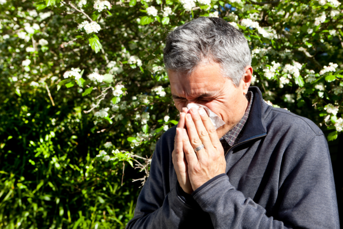 Man blowing his nose