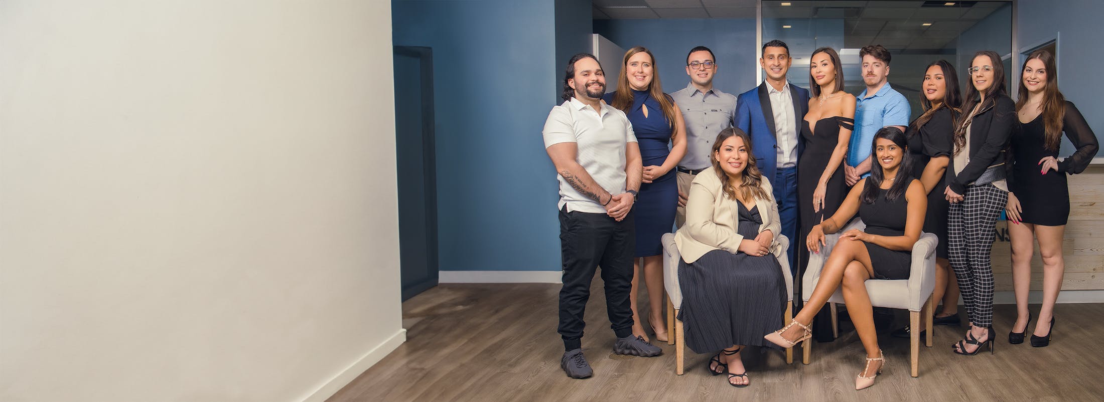 group of people posing for a picture in a room