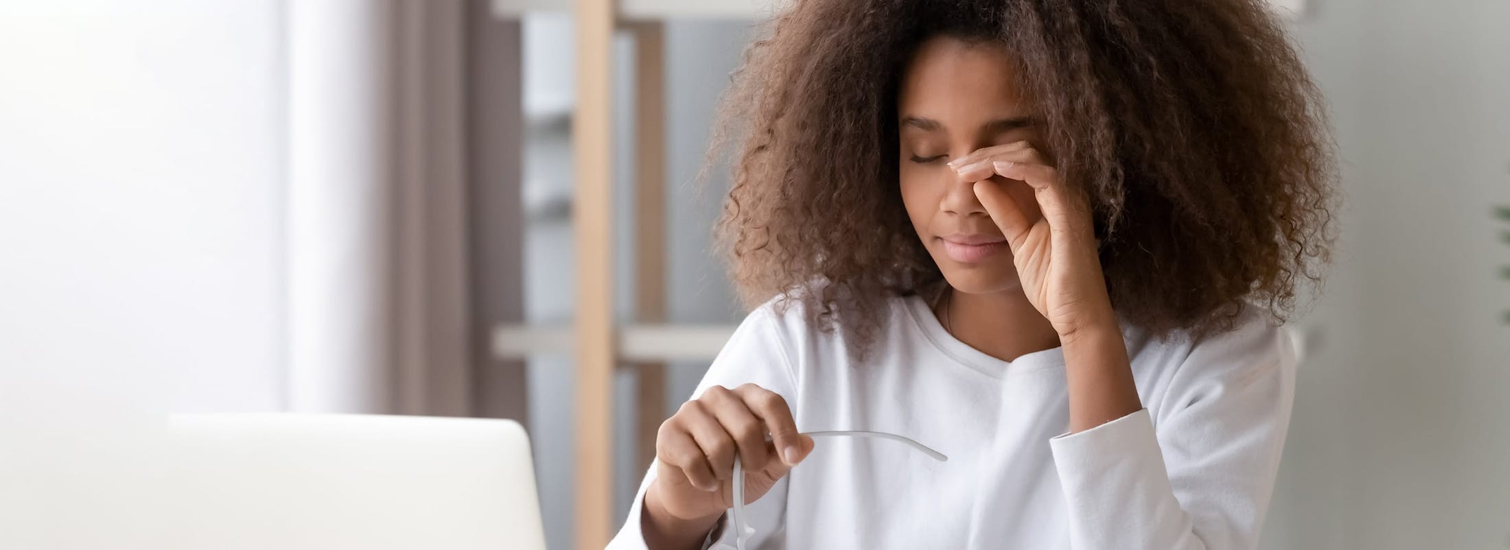 Woman rubbing her eye