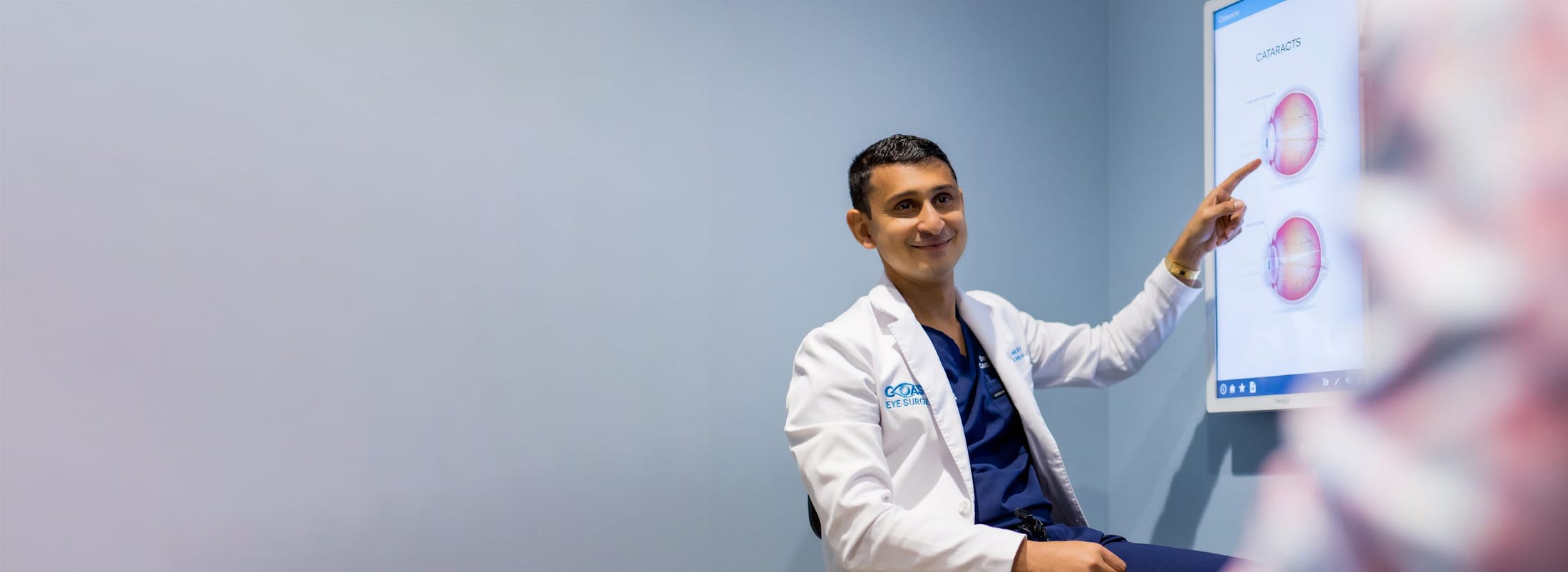 Dr. Omar Shakir pointing at screen