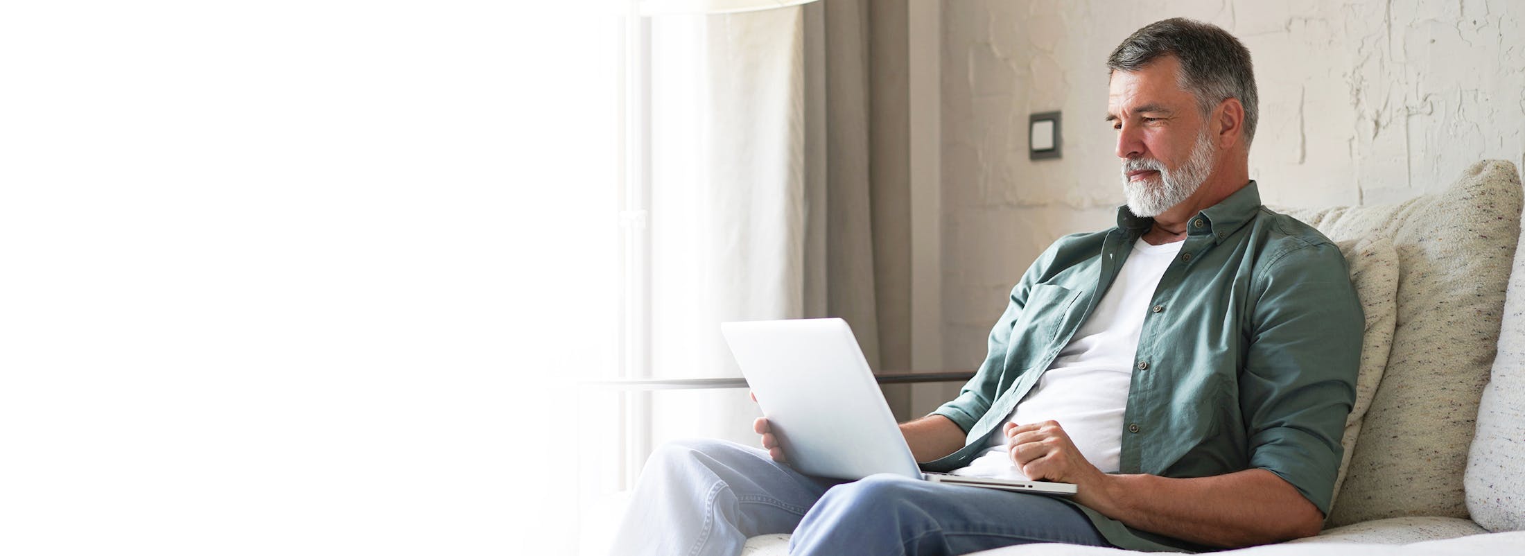 Older man looking at laptop