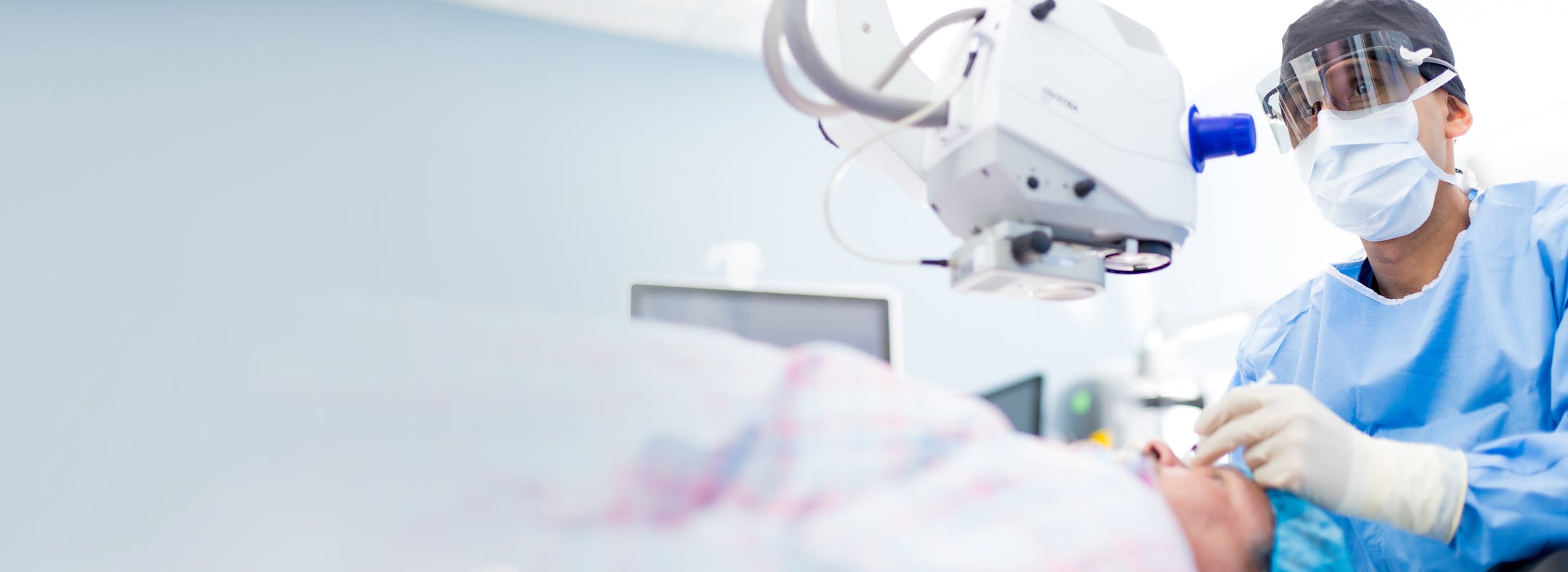 Doctor performing eye surgery