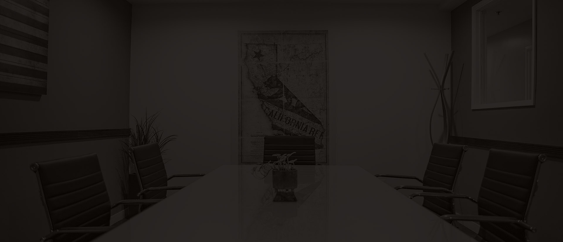 back and white picture of a conference room with a map of California on the wall