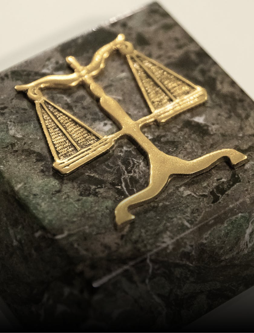 a close up of a roman scale emblem on a marble block