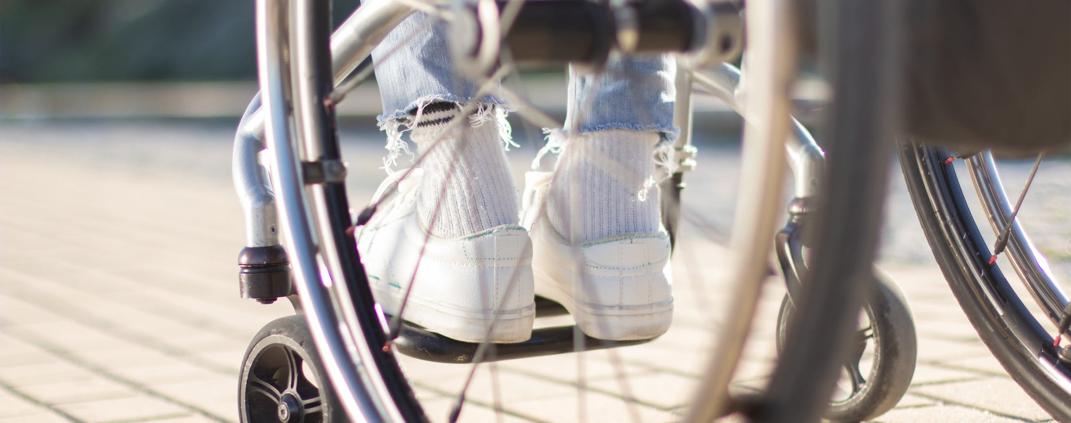 Feet in a Wheelchair - Permanent Disability Banner