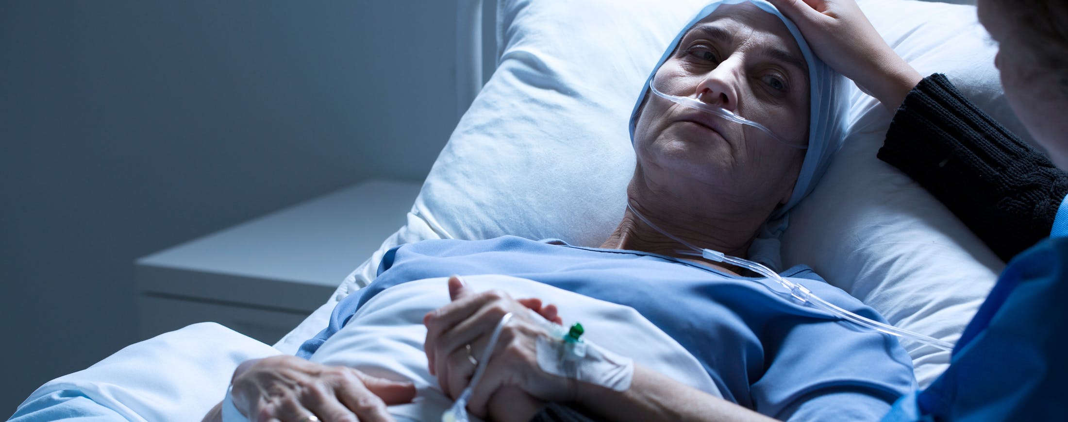 Woman in Hospital Bed with Bandages on Head - Traumatic Brain Injury Banner