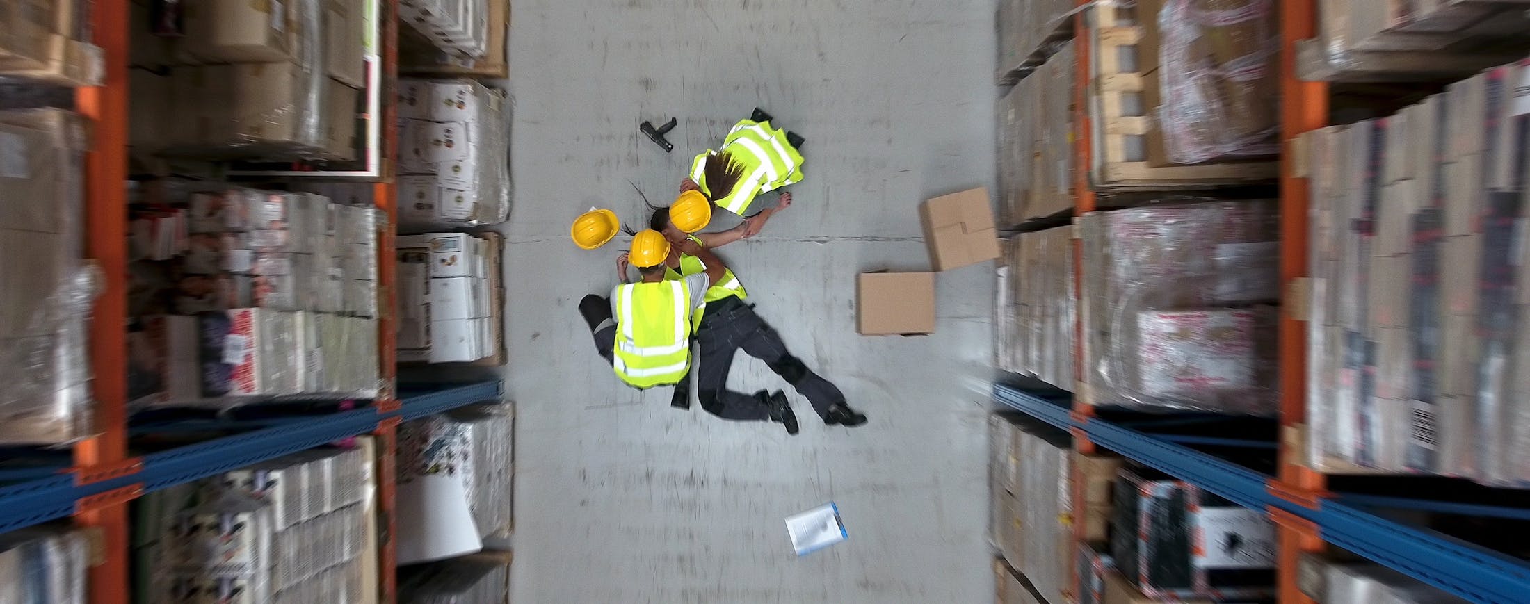 Perons Injured on Floor in a Warehouse - Workplace Injury Banner
