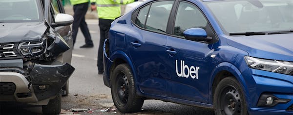 Blue Uber Car Involved in a Crash