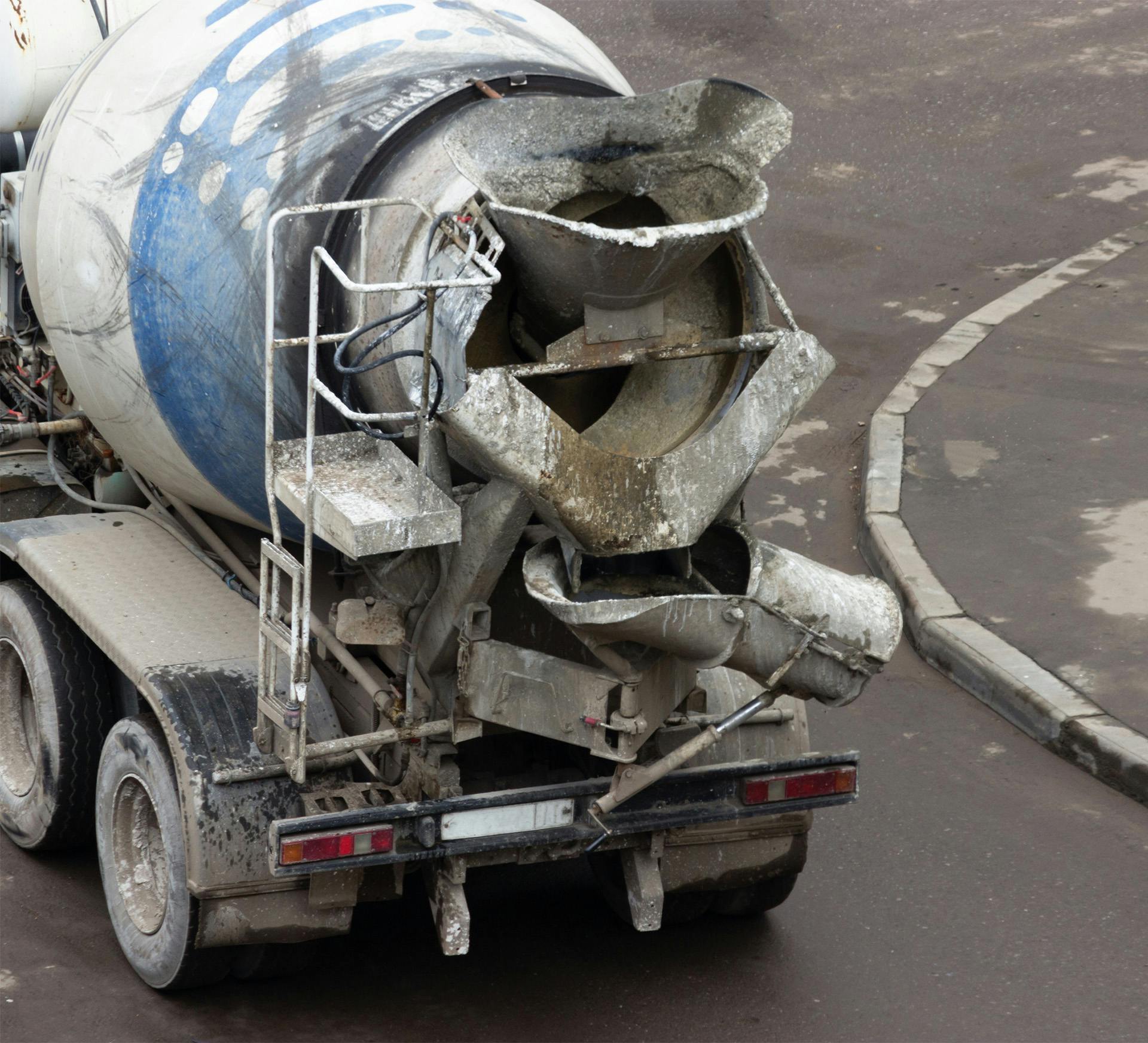 cement mixer truck on the road parked in the middle of a road
