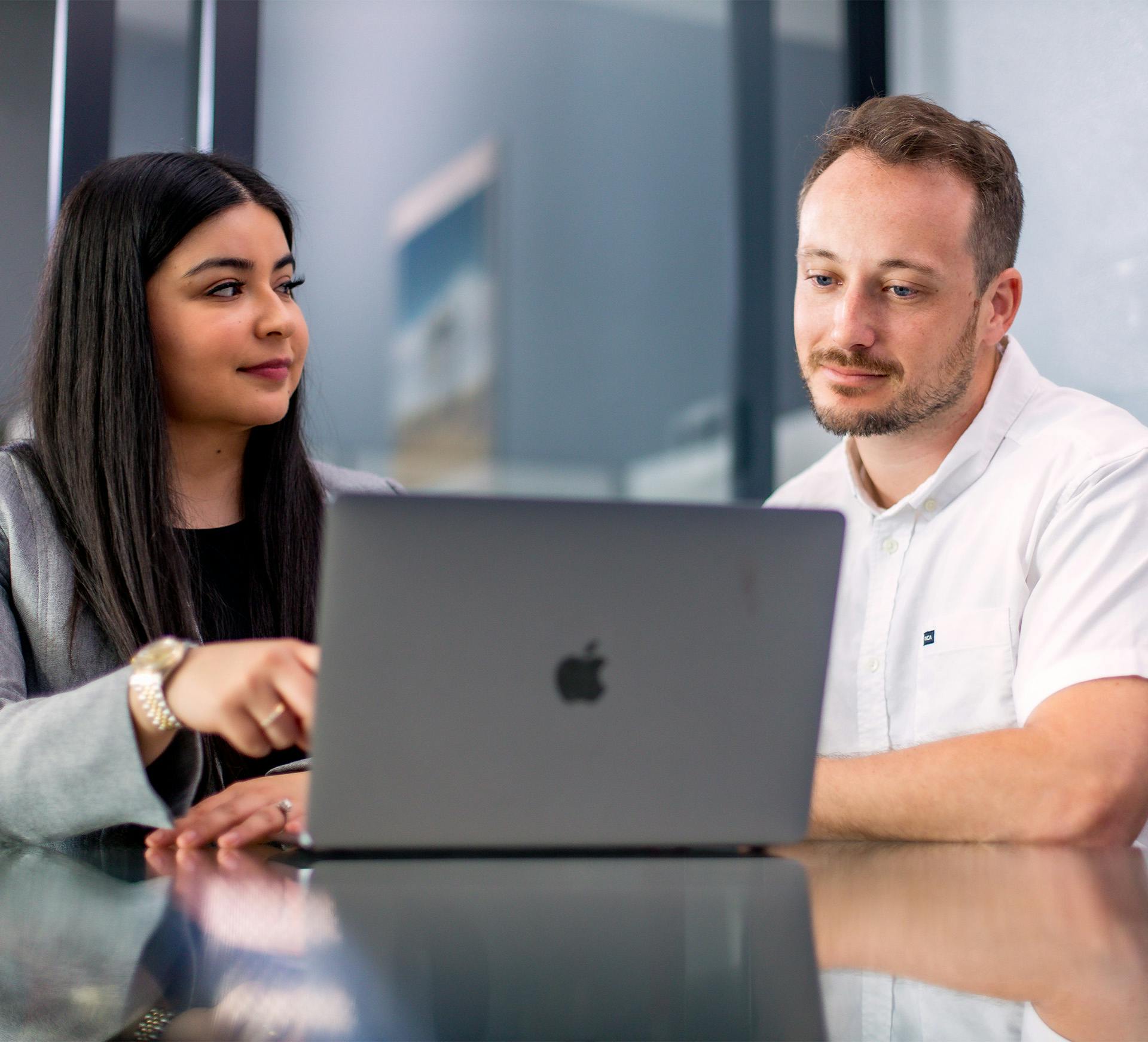 Yesenia Sanchez with Fiore Legal Injury Attorneys working with client and laptop in front of her