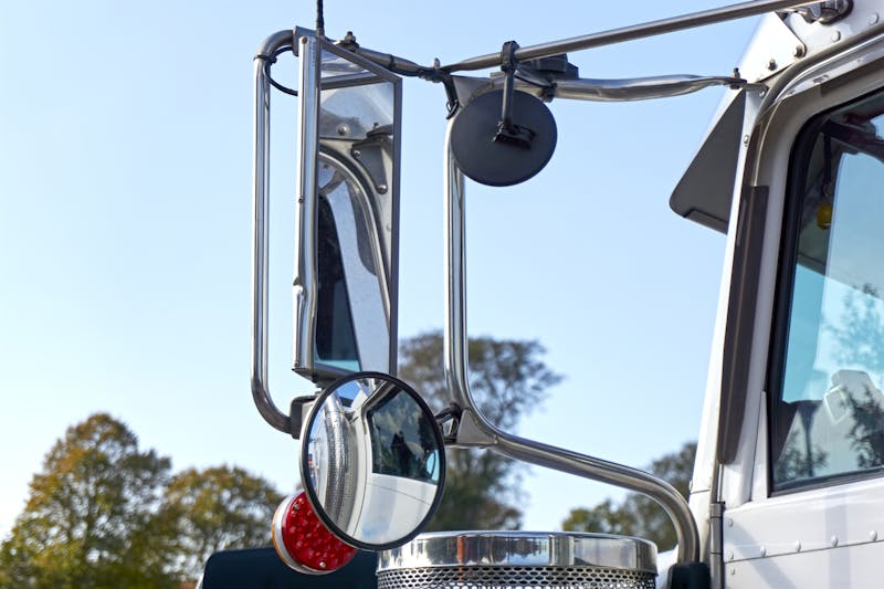 Closeup of mirrors on a cargo truck
