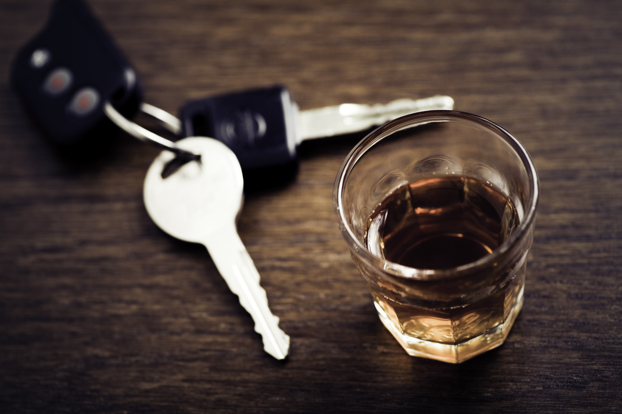 Drink next to a set of keys