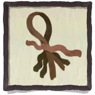 A bunch of brown roots tied in a red ribbon