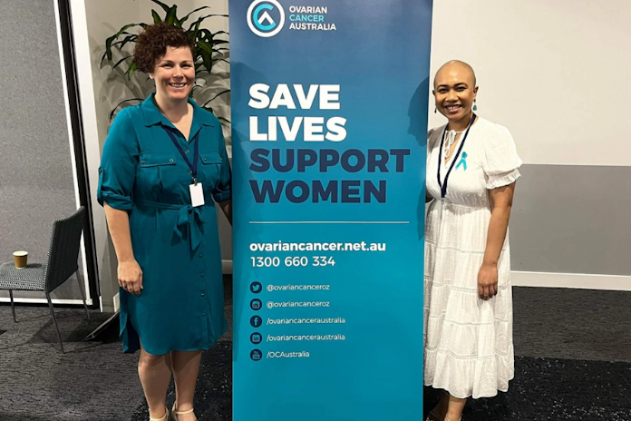 A woman with ovarian cancer and nurse at event
