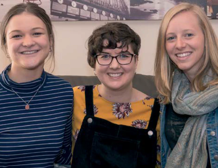 Three women smiling