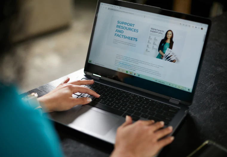 Woman looking at laptop