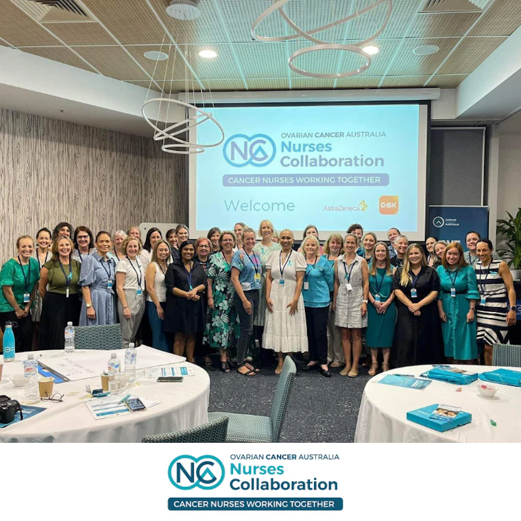 Ovarian Cancer Australia Nurses Collaboration. Large group of 40 nurses standing together for photo with woman with ovarian cancer
