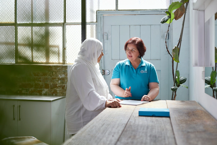 OCA support nurse talking with patient