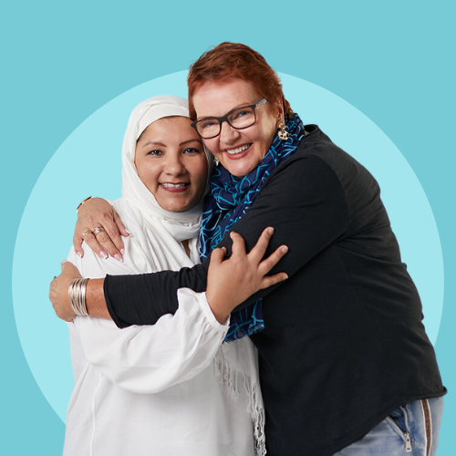 two women with ovarian cancer together smiling