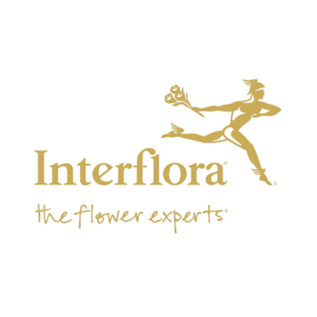 interflora logo. Gold writing featuring a gold woman running with a bouquet