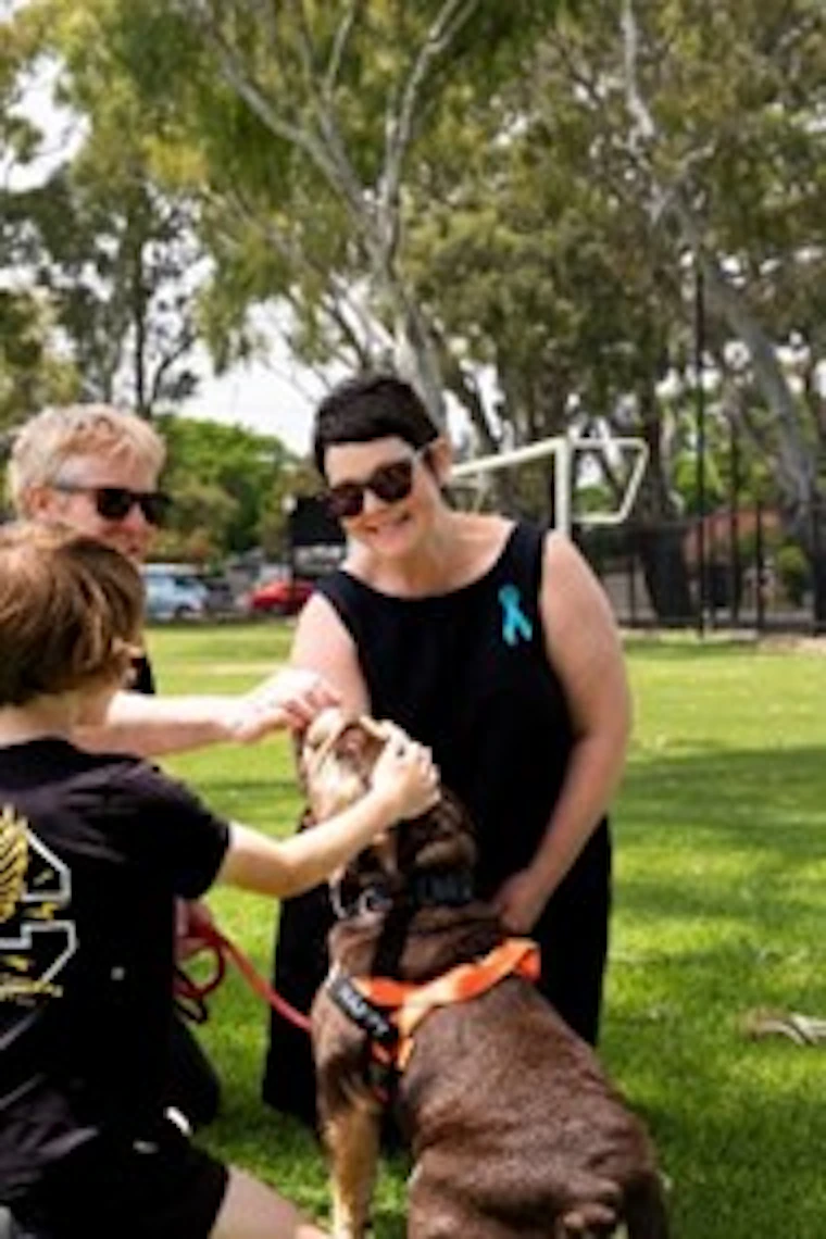 georgie patting her dog