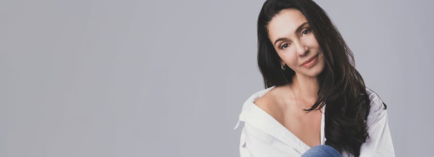 brunette woman with an off the shoulder shirt