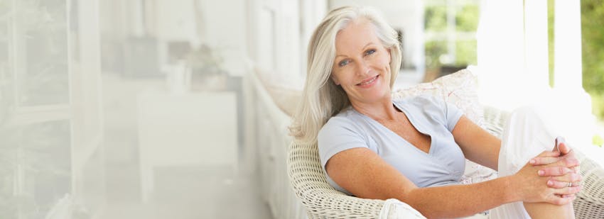 woman with long white hair sitting