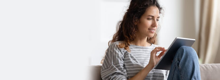 brunette woman on tablet