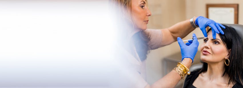 Dr. Shermak injecting a patient