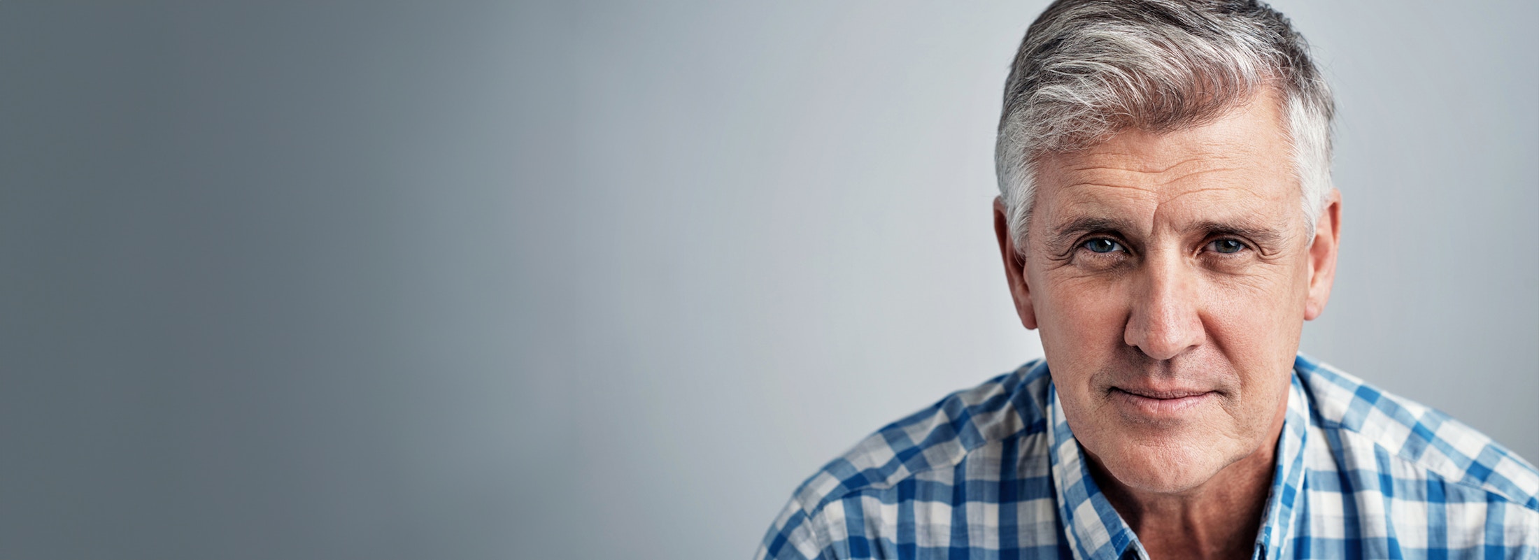 middle aged man with white hair