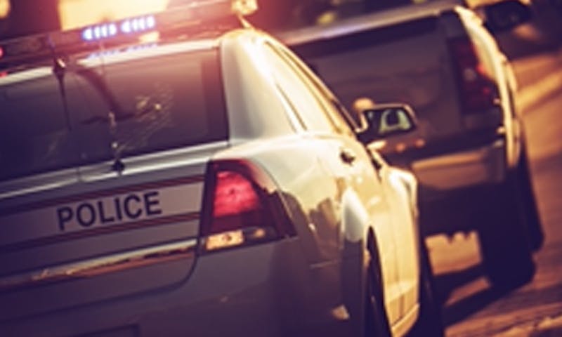 Police pulling a truck over