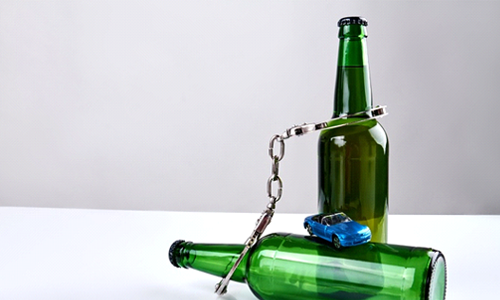 Two bottles with handcuffs