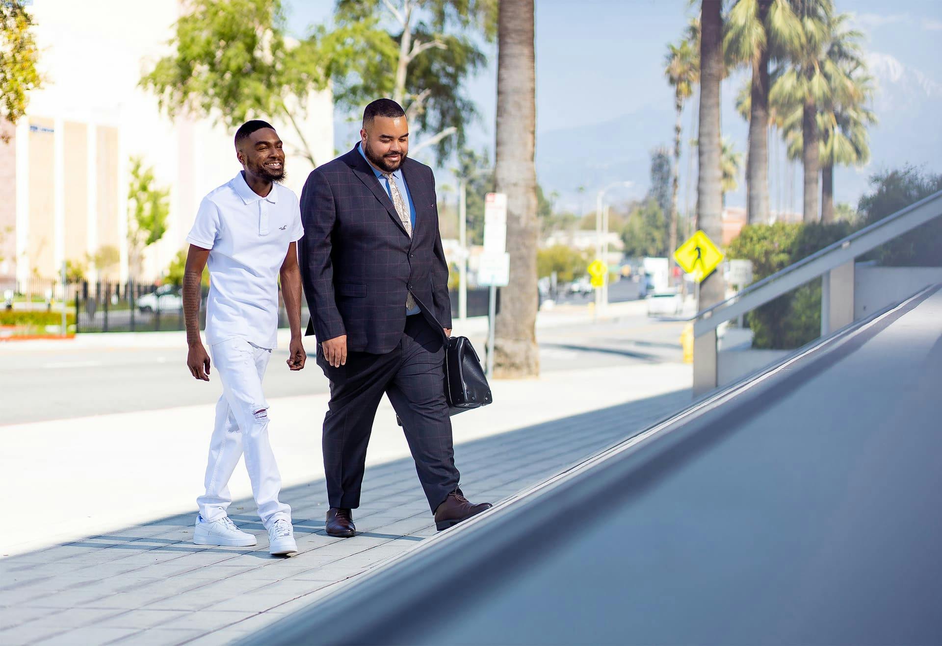 Vincent Hughes walking with a client