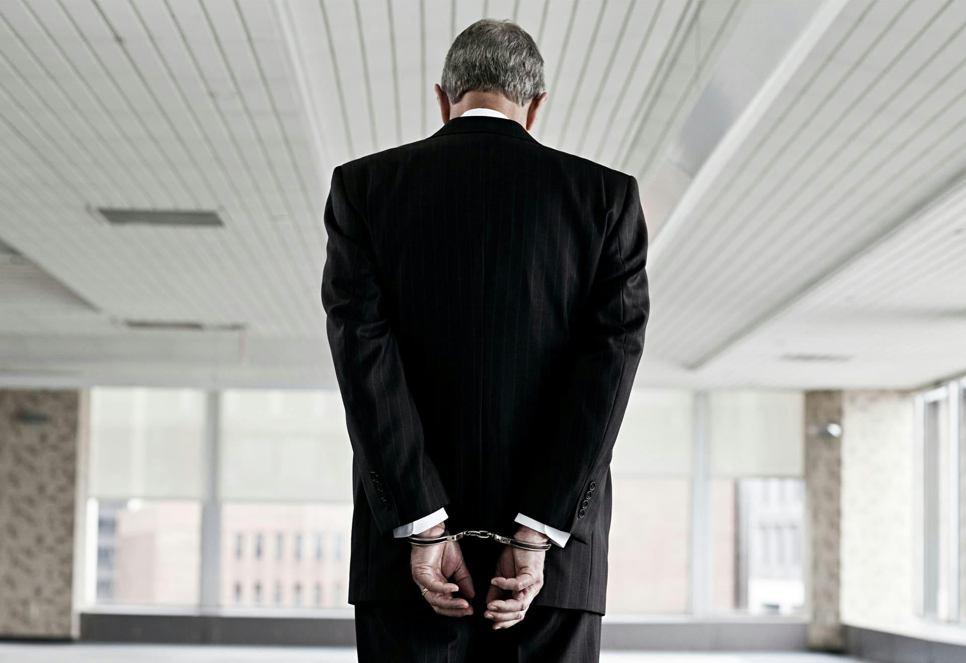 Man in handcuffs and a business suit