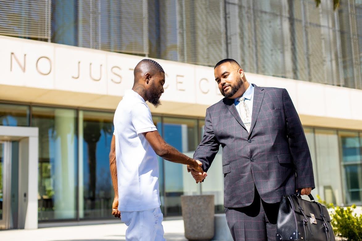 Vincent Hughes shaking hands with a man
