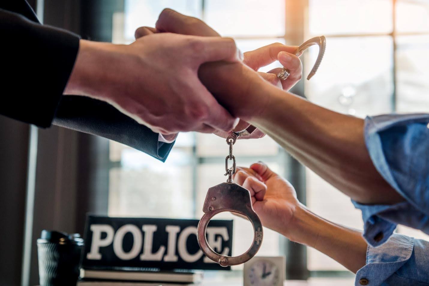 Person being put in handcuffs