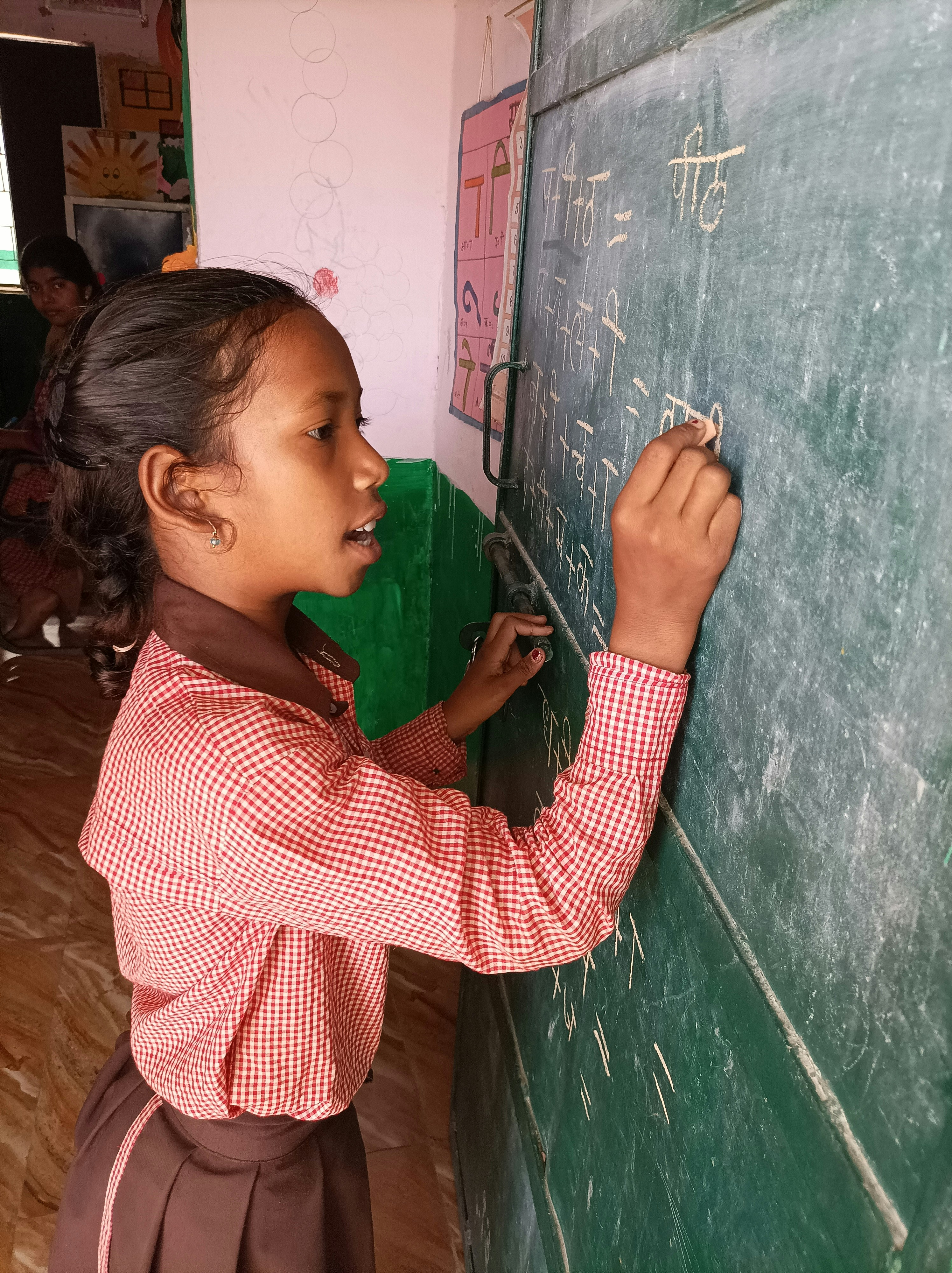 Child writing on board