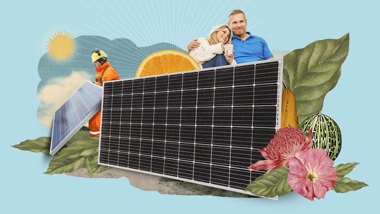 a man and woman sitting on top of a solar panel