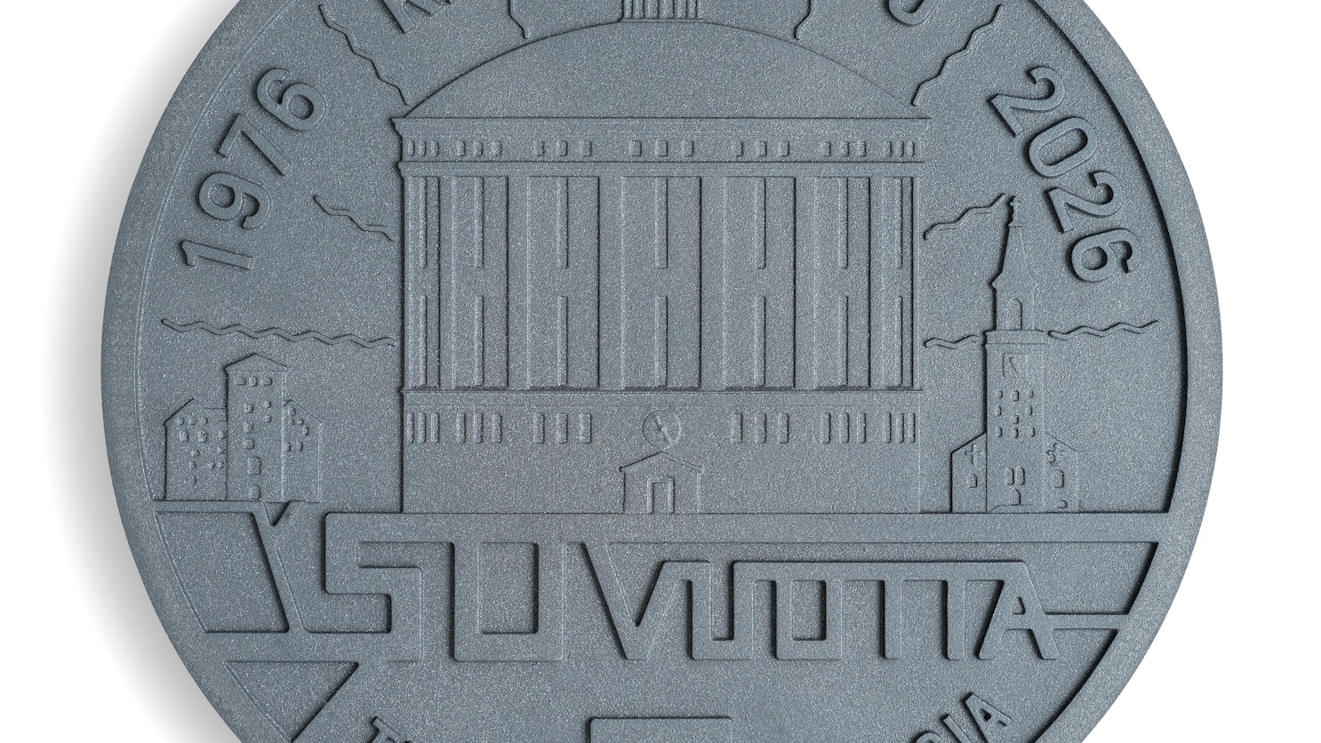 Valurautainen kaivonkansi, jossa kaasukello keskellä ja maan alla kulkeva kaukolämpöverkosto