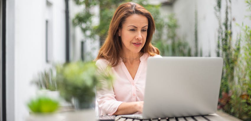 woman looking at a laptop