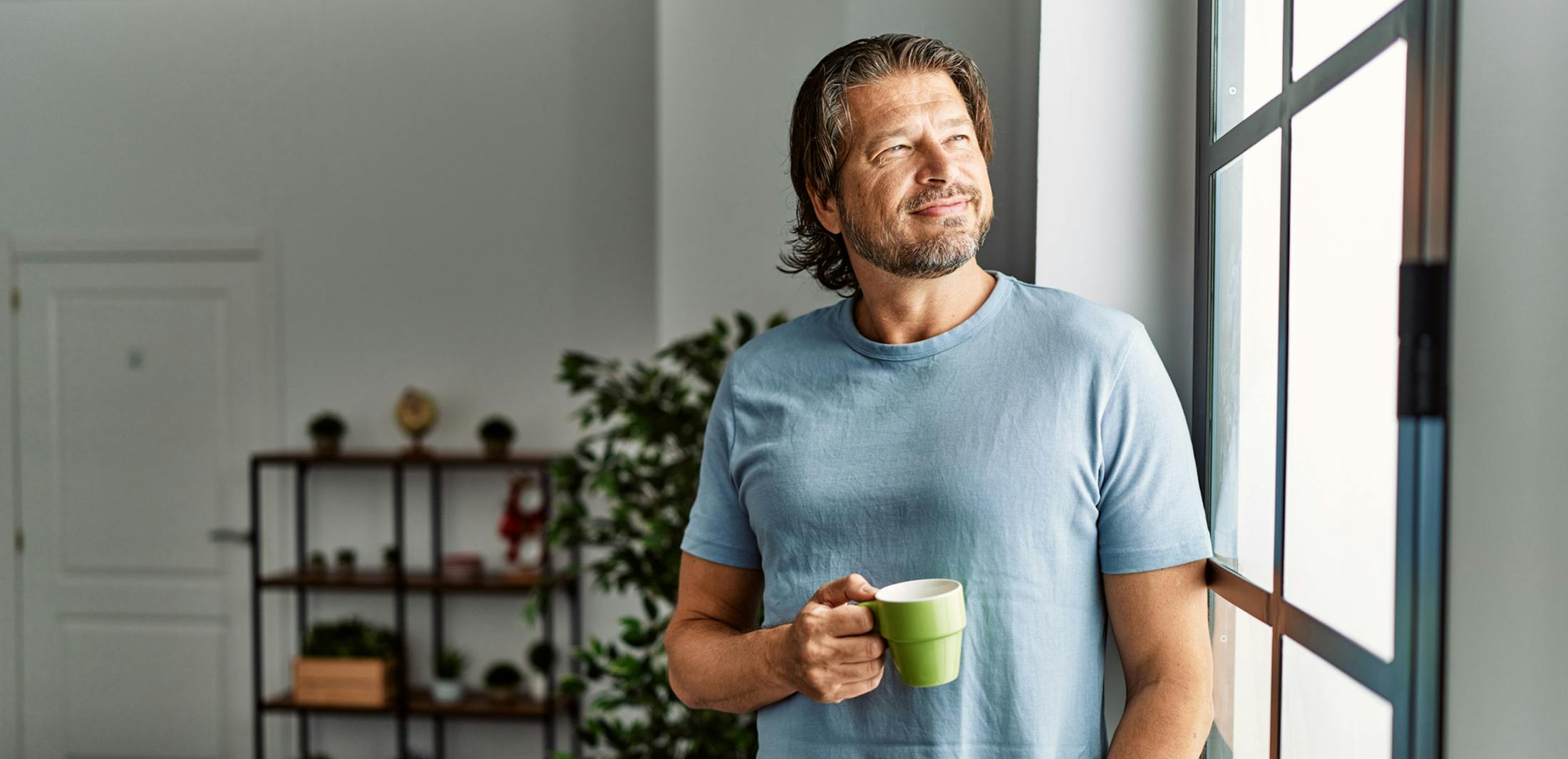 man holding a coffee cup