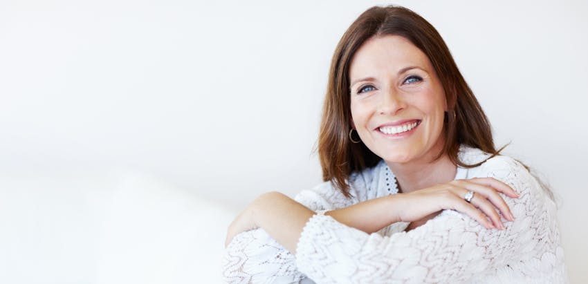 woman crossing her arms and smiling