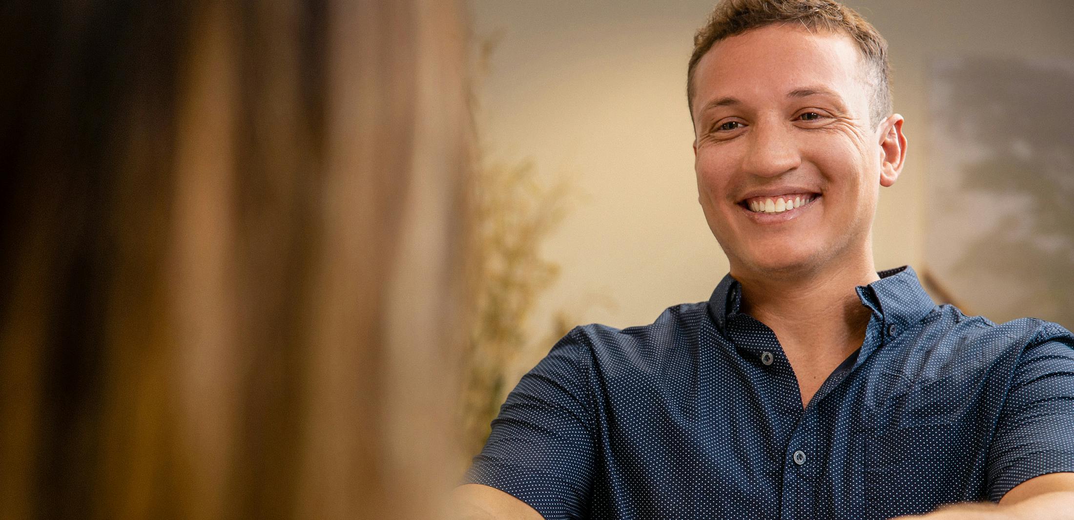 man smiling at a someone else