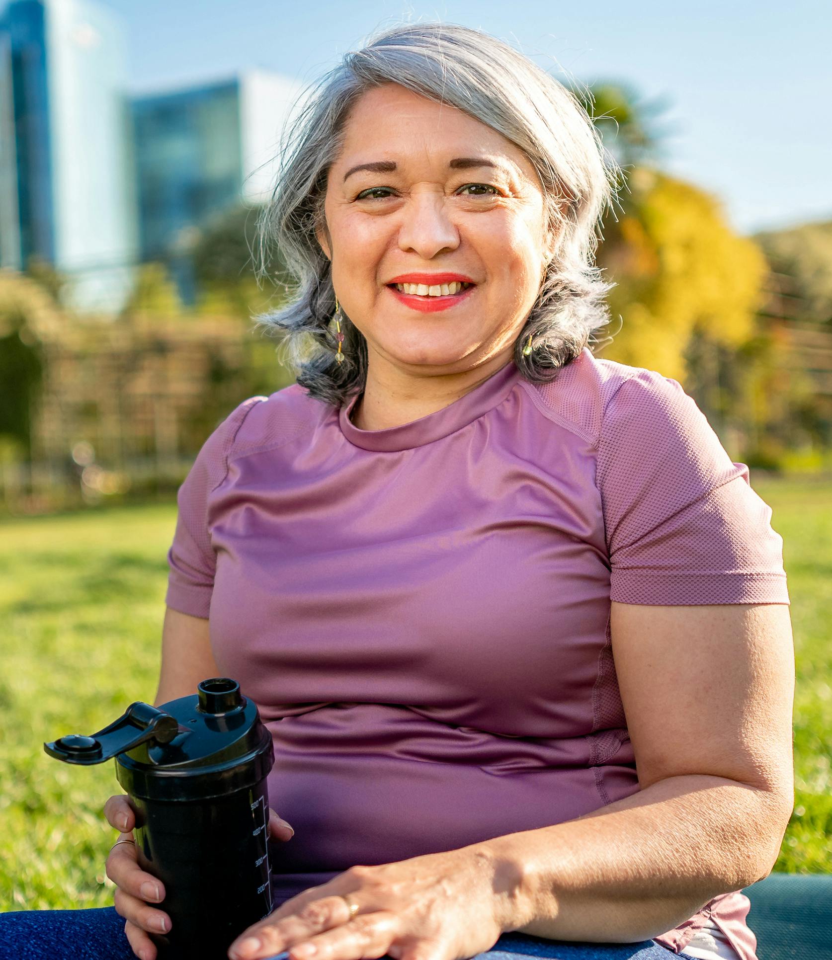 woman holding a water bottle