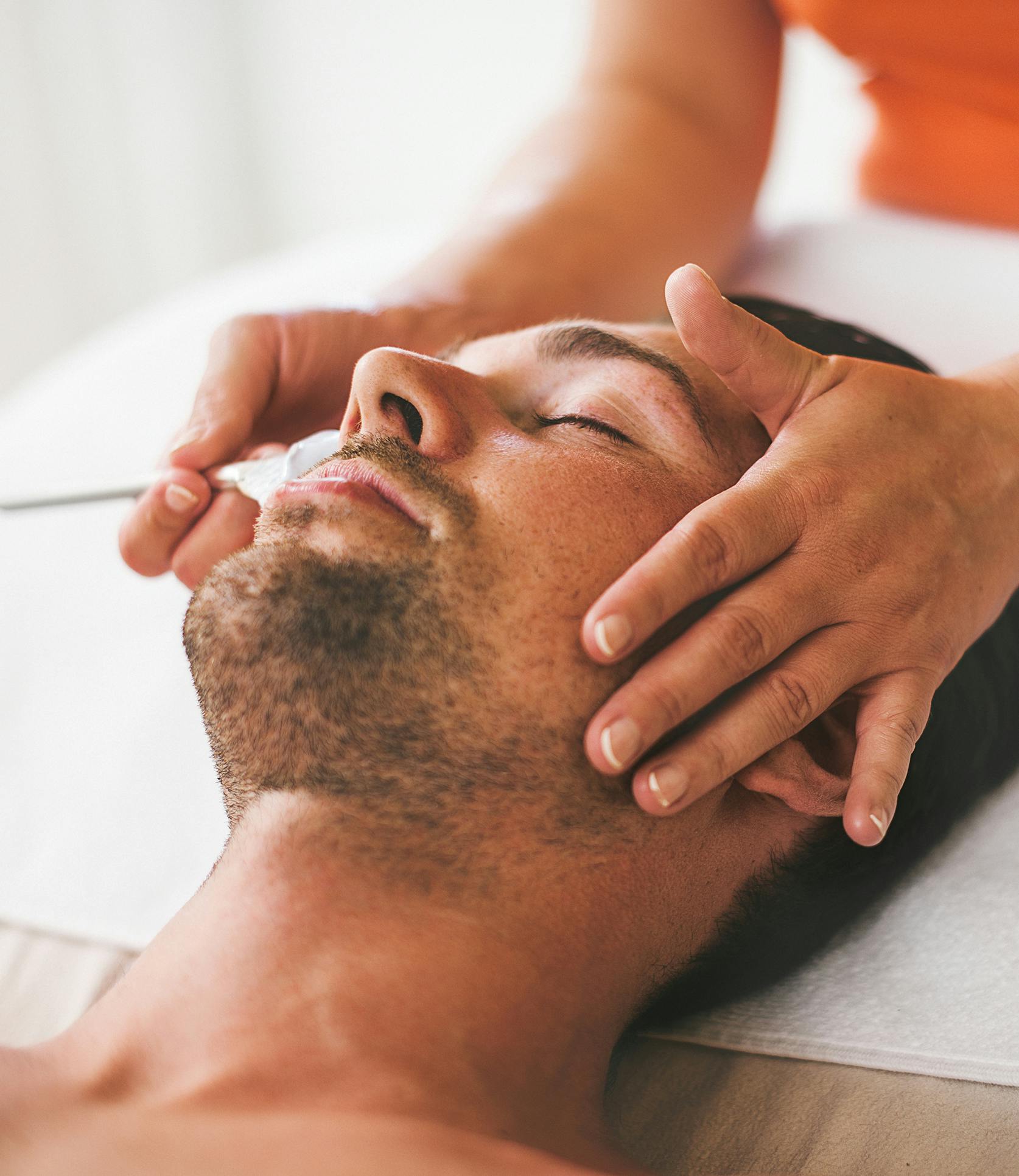 man getting a facial