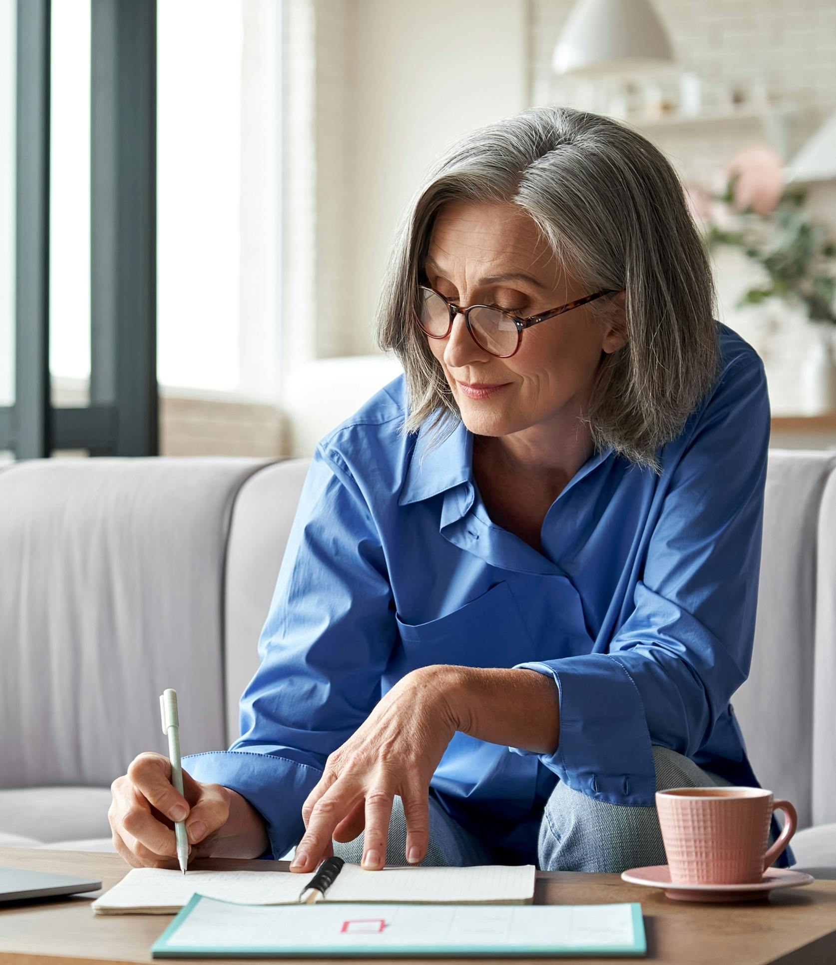 woman writing in a notebook