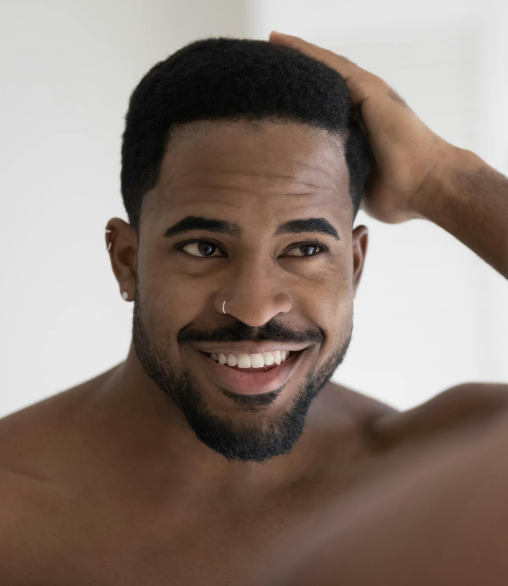 man running his hand through his hair