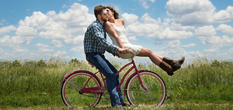 man and woman on a bike