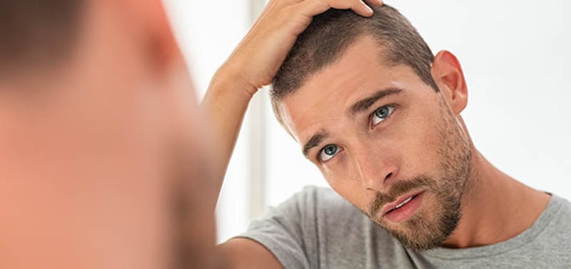 man looking in the mirror