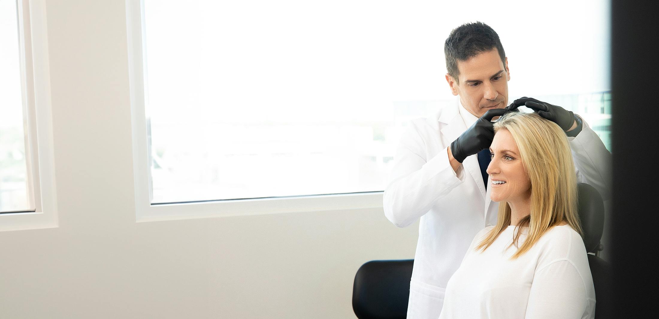 Dr. Greco with a woman patient